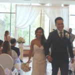 An image of a bride and groom walking down the aisle as husband and wife; taken from a Toronto Wedding Video